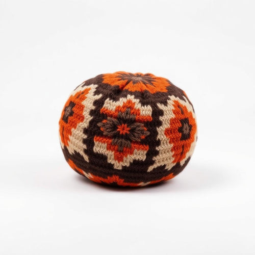 Knit woolen footbag with earthy geometric pattern